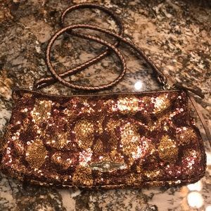 Bronze and gold sequined clutch bag with shoulder strap.